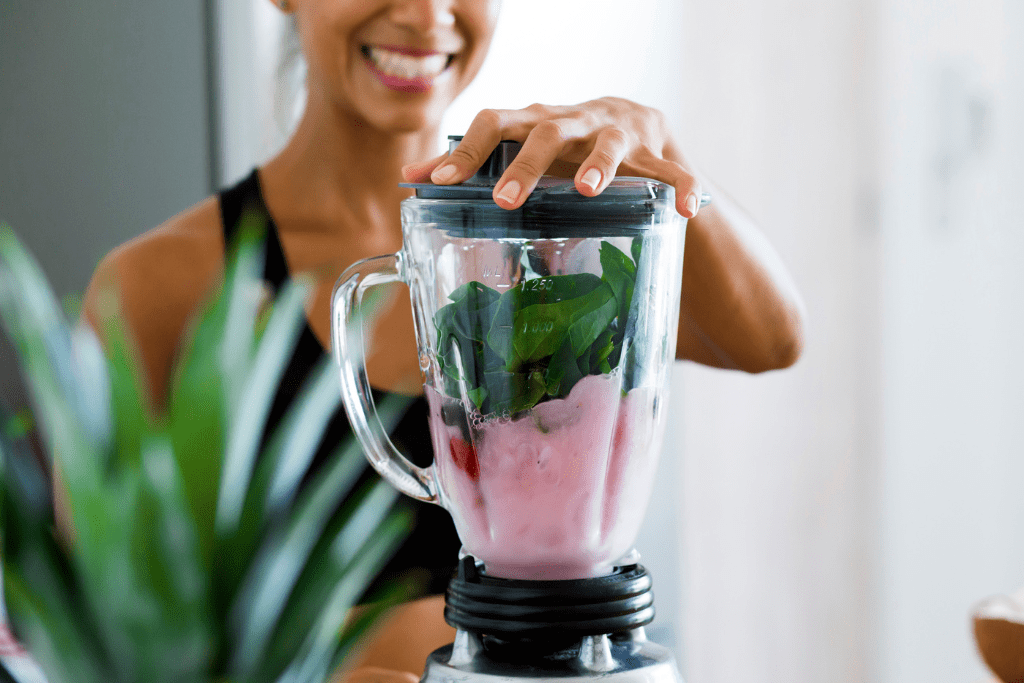 woman making a smoothie